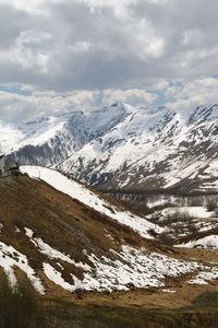 Scenic view of snowcapped mountains against sky