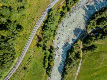 High angle view of river amidst green landscape