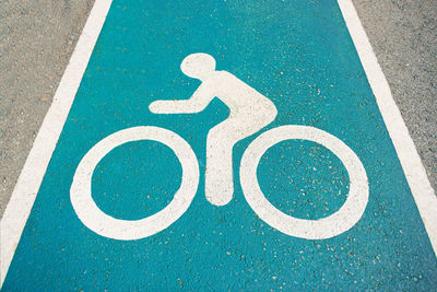 High angle view of bicycle sign on road