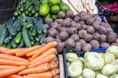 Carrots, celeriac and beetroot for sale at a market