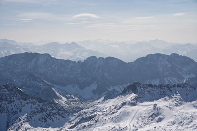 Scenic view of snowcapped mountains against sky