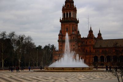 View of historic building against cloudy sky