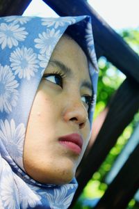 Close-up of woman in hijab looking away outdoors