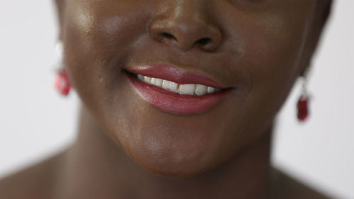 Close-up of woman wearing pink lipstick