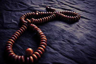 High angle view of bead necklace on table