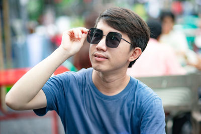 Portrait of young man wearing sunglasses