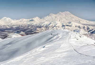 Scenic view of snowcapped mountains against sky