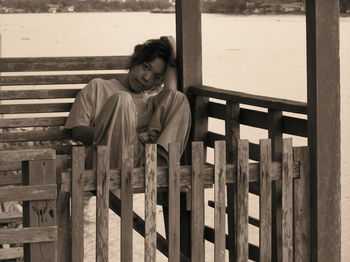 Portrait of teenage girl sitting on bench