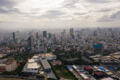 High angle view of buildings in city against sky