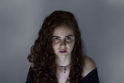 Portrait of a beautiful young woman over white background