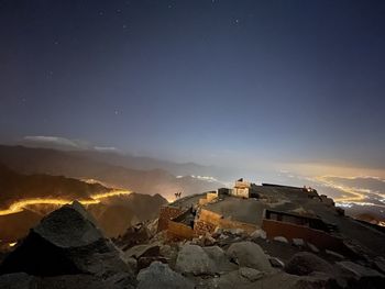 Scenic view of mountain against sky at night