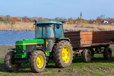 Tractor on field against sky