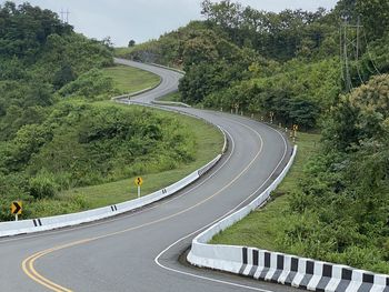 High angle view of vehicles on road amidst trees