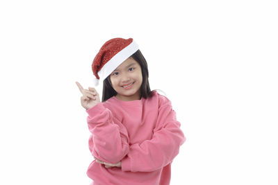 Portrait of a smiling girl against white background