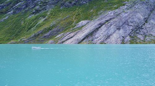 Scenic view of sea against mountain