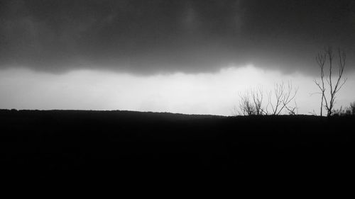 Silhouette landscape against sky