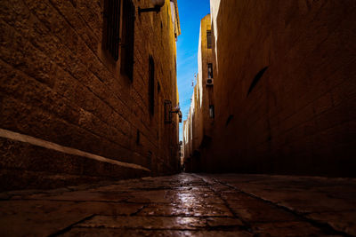 Narrow alley along buildings