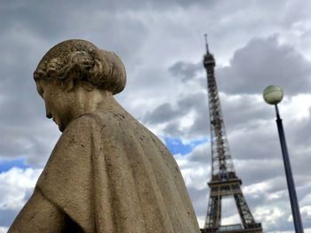 Low angle view of statue against cloudy sky