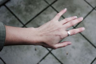 High angle view of woman hand over blurred background