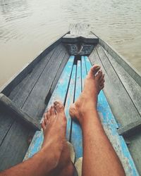 Low section of person on boat in sea