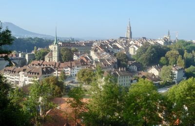 High angle view of houses against blue sky