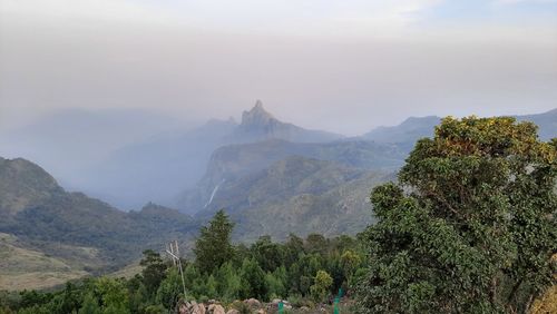 Beautiful scenic view from kodanad view point ooty of misty rain cloud hill mountain green forest