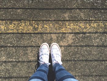 Low section of person standing on ground