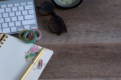 High angle view of eyeglasses on book