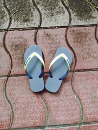 High angle view of shoes on tiled floor