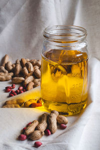 Still life of peanut oil in jar