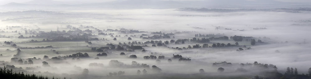 Panoramic view of mist covered landscape