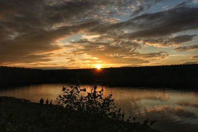 Scenic view of lake against sky during sunset