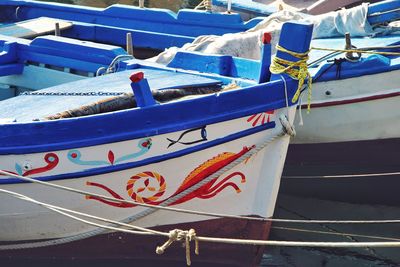 Boats moored at harbor