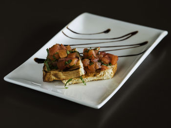 Bruschettas served in tray on table