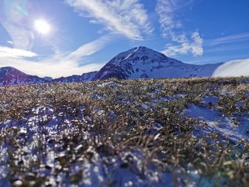 Scenic view of snowcapped mountains against sky