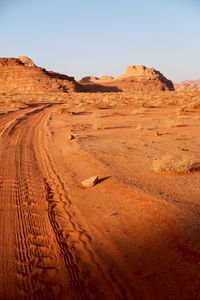 Scenic view of desert against clear sky