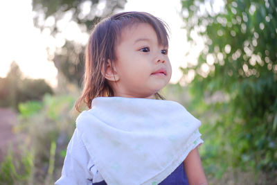 Portrait of cute girl standing outdoors