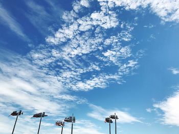 Low angle view of windmill against blue sky