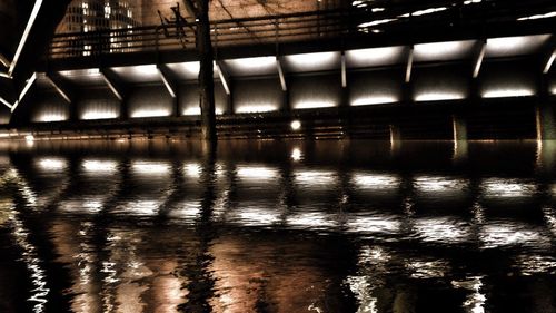 Reflection of illuminated building in water
