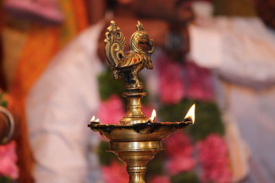 Close-up of metallic oil lamp during event