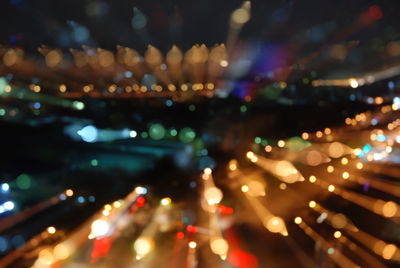 Low angle view of illuminated lights at night