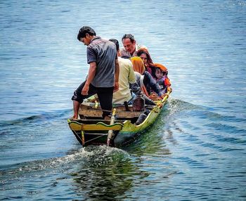 People on boat in lake