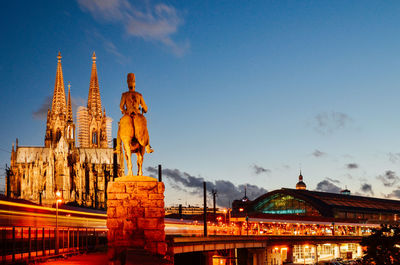 Cologne cathedral and emperor william monument against sky