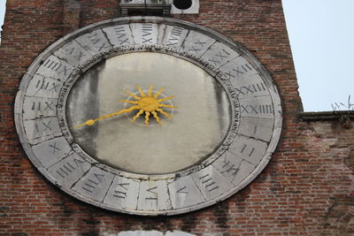 Close-up of clock on wall