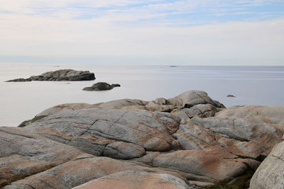 Rocks on shore against sky