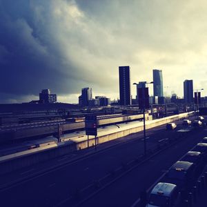 City skyline against cloudy sky