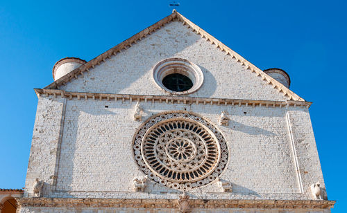 Low angle view of building against clear blue sky