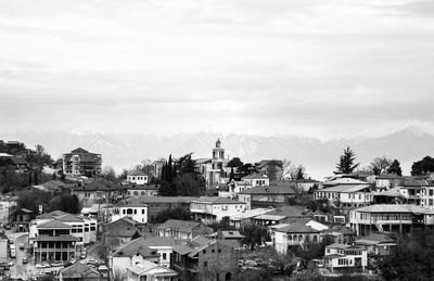 Buildings in city against sky