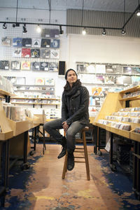 Young man browsing albums in a record store