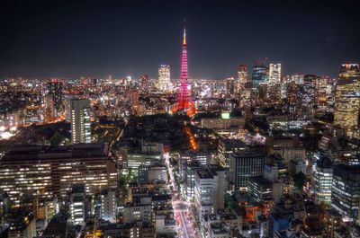 High angle view of city lit up at night